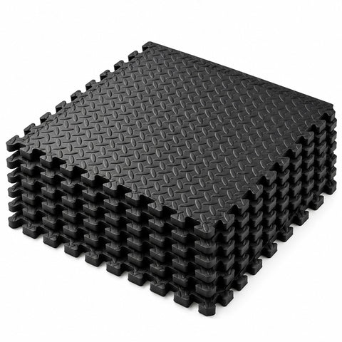 MotionGrey plain black EVA foam gym flooring mat, stack of six interlocking tiles with raised tread texture.