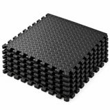 MotionGrey plain black EVA foam gym flooring mat, stack of six interlocking tiles with raised tread texture.