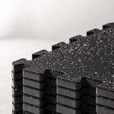 Close-up of dual-layer gym flooring with a rubber top and cushioned EVA foam base, 1.5 cm (15 mm / approximately 0.59 inch) thick.