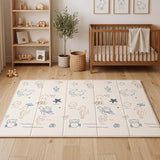 Blessy foldable baby play mat with cream ocean illustrations in a styled nursery