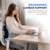Woman using a black lumbar support cushion in an office chair