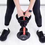 Woman gripping the kettlebell handle attached to an adjustable dumbbell