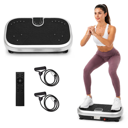 MotionGrey vibration plate with remote and resistance bands beside a woman doing a squat