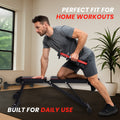 Man performing a one-arm dumbbell row on the adjustable workout bench in a home gym