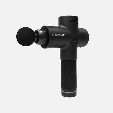 Black MotionGrey percussion massage gun with round foam head