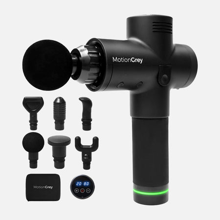 Black percussion massage gun with six interchangeable massage heads