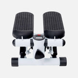 White mini elliptical stepper with dual black pedals, shown from the front