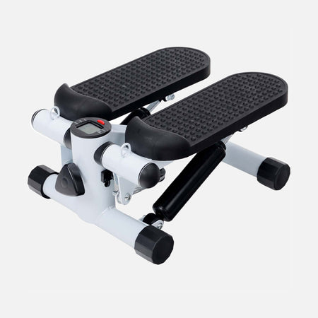 White mini elliptical stepper with black pedals in an angled view