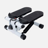 White mini elliptical stepper with black pedals in an angled view