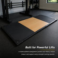 MotionGrey weightlifting platform installed in a home gym