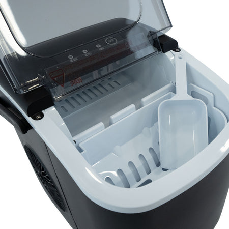 Open countertop ice maker showing the ice basket and scoop