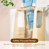 Child holding the safety rail of the Blessy Baby Learning Tower