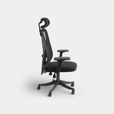 Black ergonomic mesh office chair with headrest in side profile