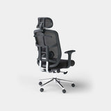 Black ergonomic mesh office chair from a rear three-quarter angle