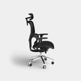 Black mesh office chair with headrest in side profile