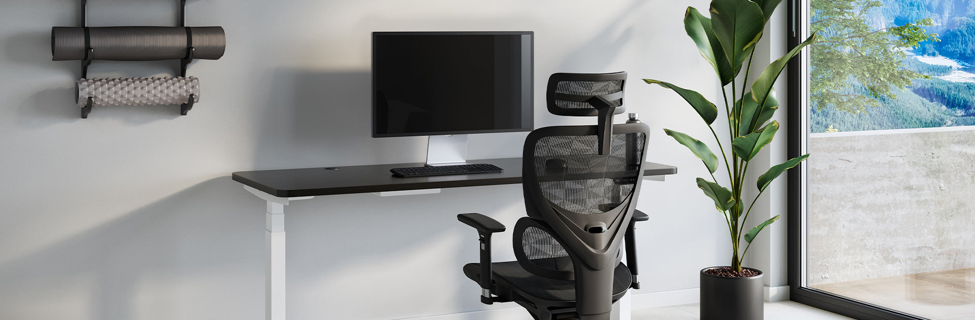 Modern home office setup with standing desk and ergonomic chair