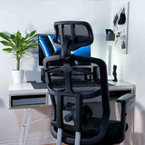 Black mesh office chair positioned at a modern home office desk