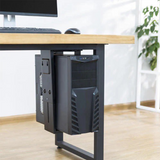 Side view of a computer tower secured beneath a wood desk
