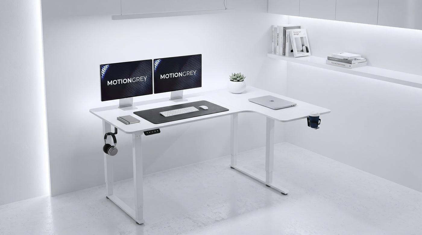 White MotionGrey L-shaped standing desk in a bright home office